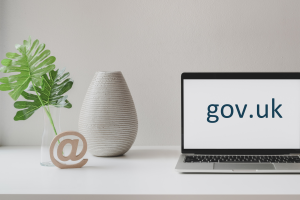 An image of a computer on a desk with the phrase 'gov.uk' on the screen.