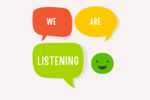 There are three speech bubbles in red, yellow, and green, which say 'we are listening'. There's also a green smiley face.